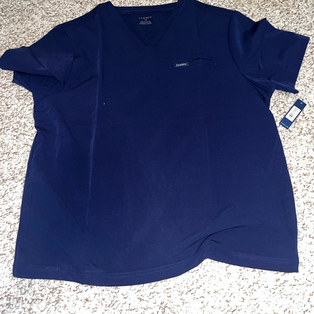 Brand new Jaanuu Men’s scrubs. 4 tops. 2 joggers.